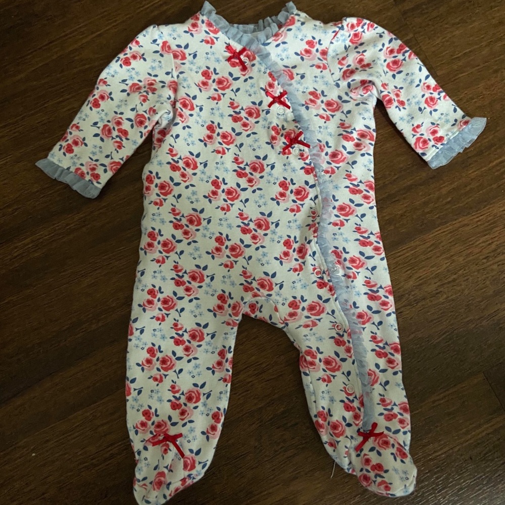 White floral print long sleeved onesie